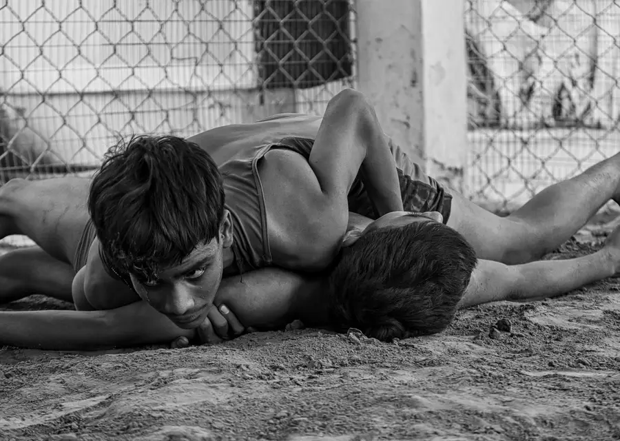 Two young wrestlers training in traditional Indian kushti