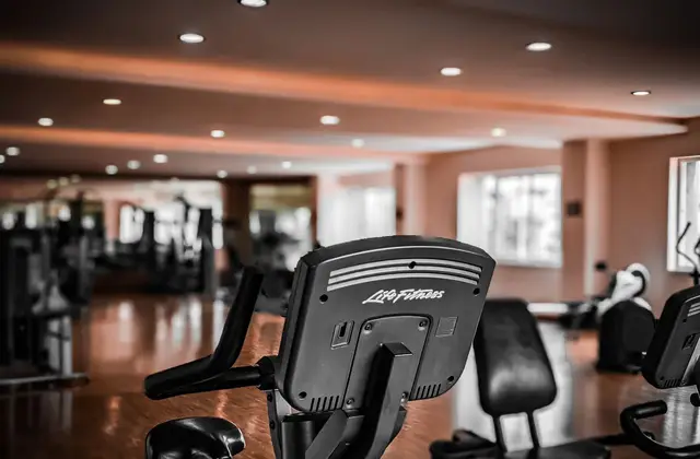 Gym floor with exercise bikes and strength machines