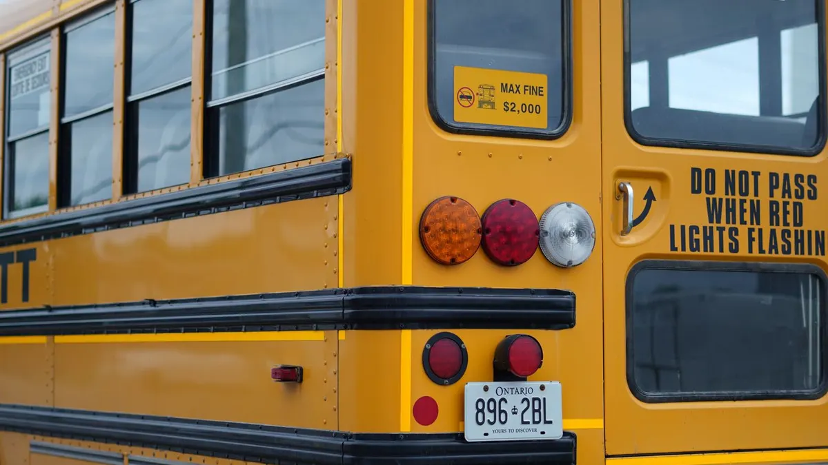 School principal reviewing school bus safety GPS tracking benefits