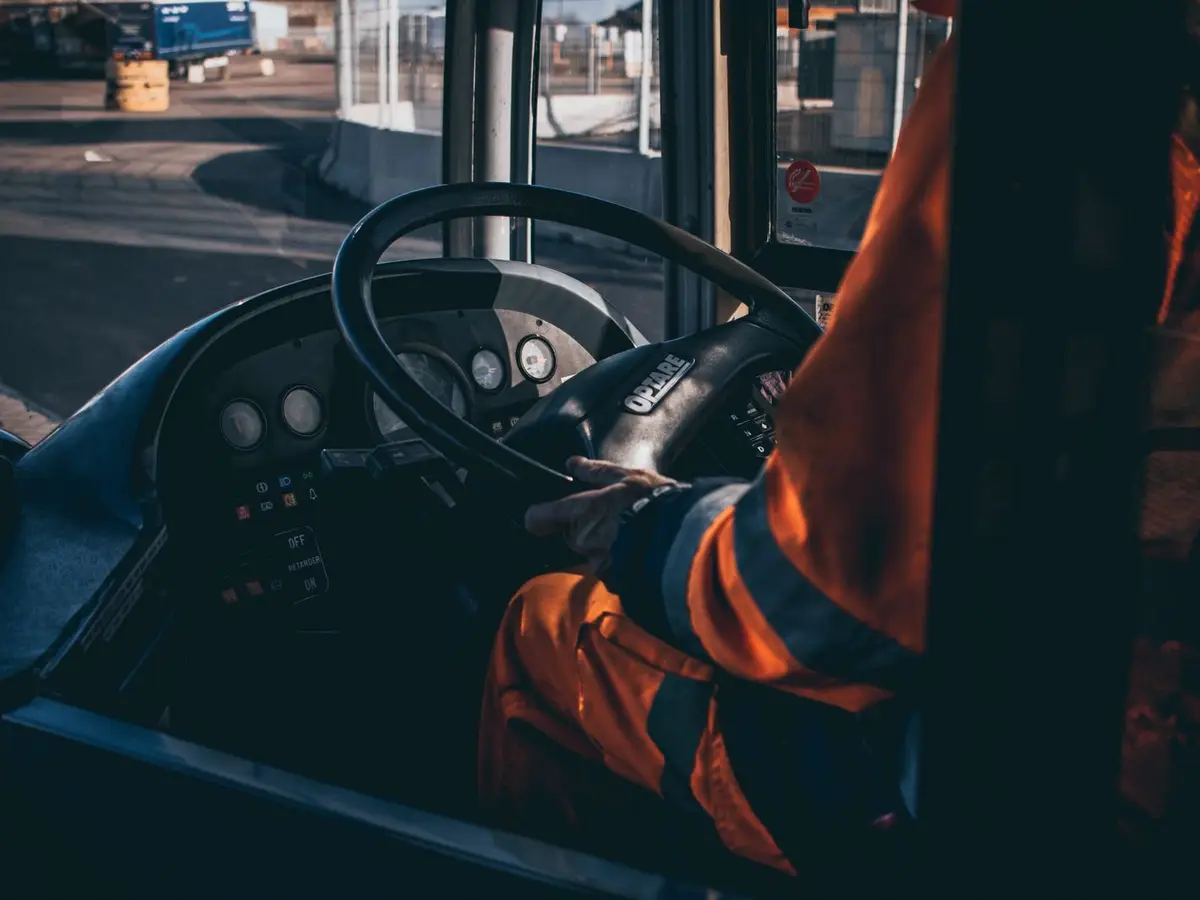 Bus driver at the steering wheel