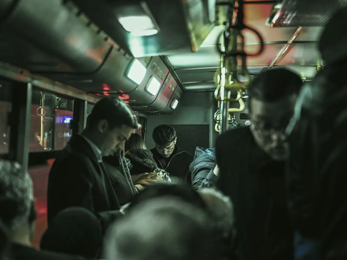 Crowded bus with passengers standing