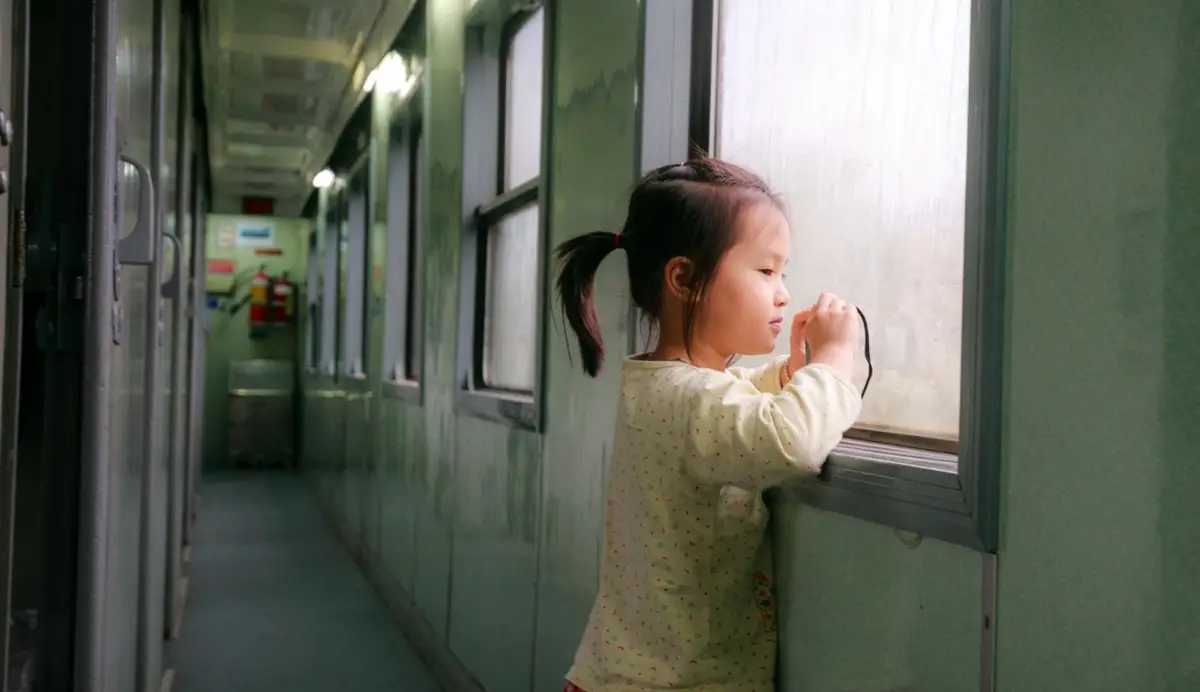 Child looking out of a vehicle window