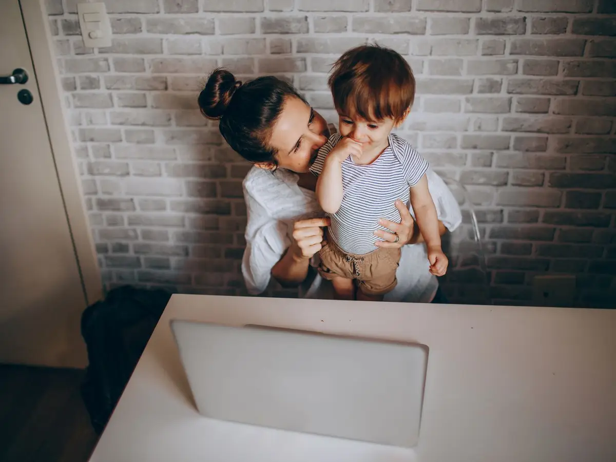 Working parent at a laptop