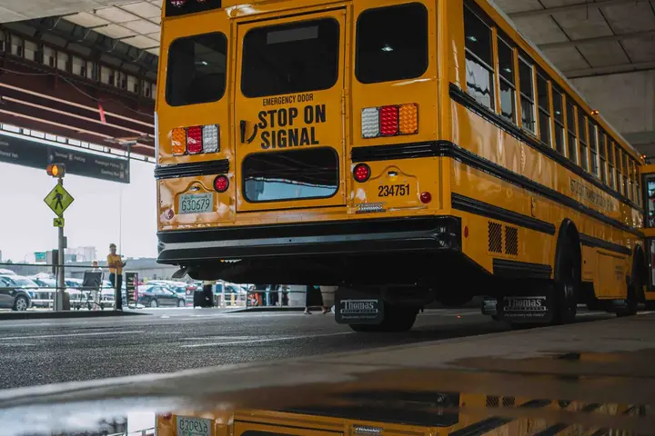 Yellow school bus on the road